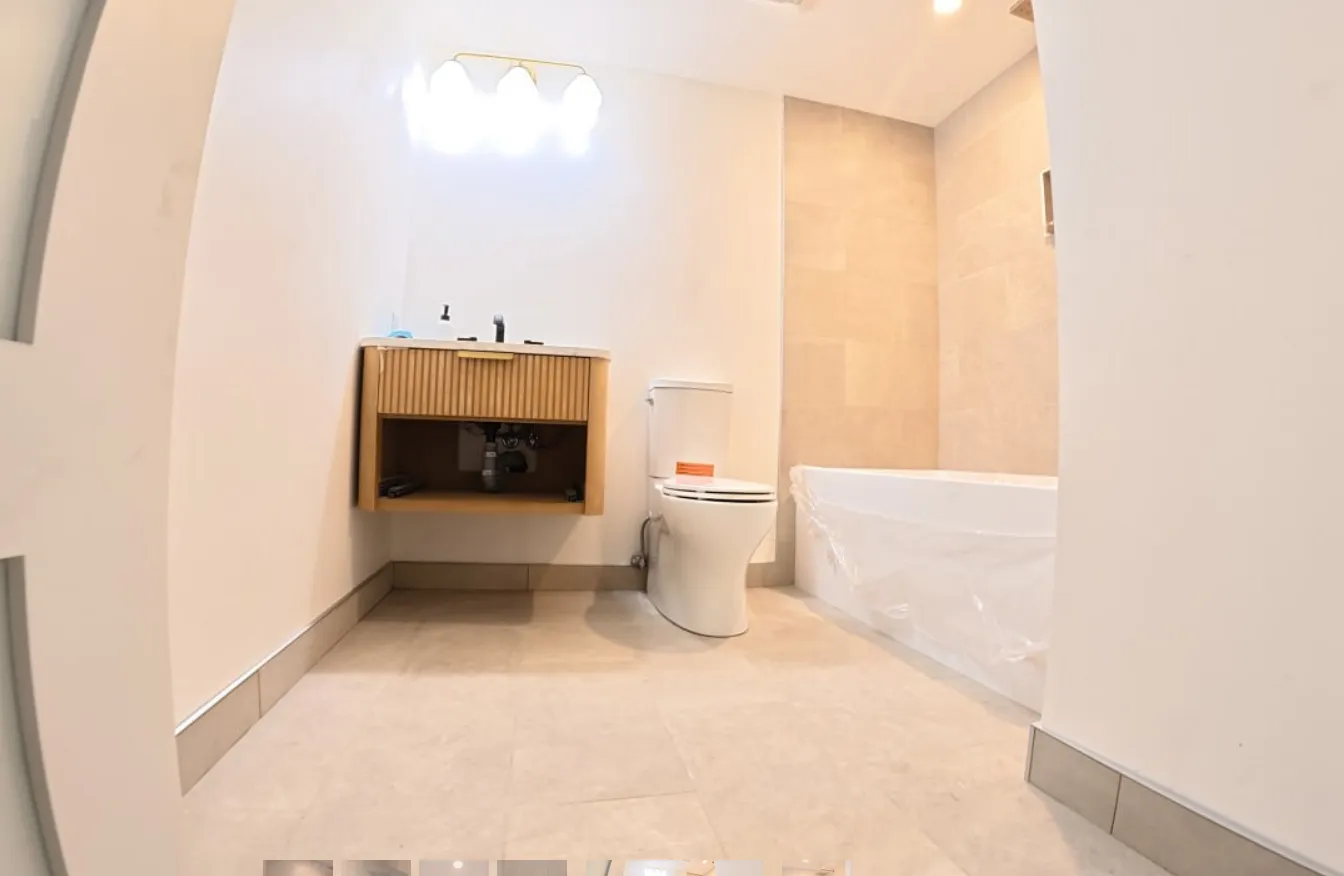 Hand-set marble tile bathroom with floating vanity — British Columbia renovation by NovoTile Atelier