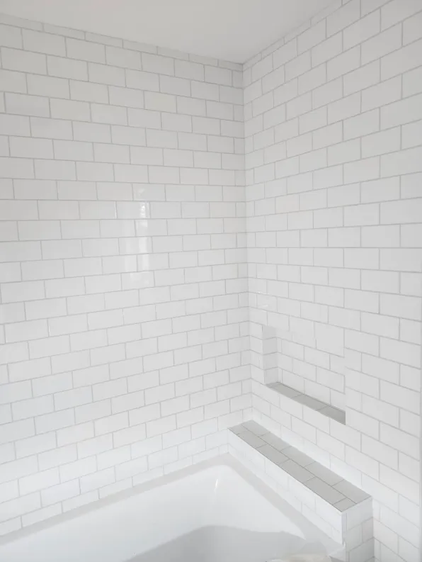 Curbless shower with custom niche and waterproofing — wet room build in British Columbia