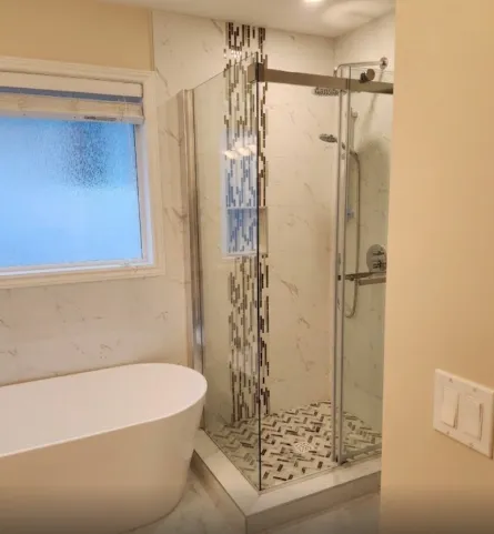 Hexagon mosaic shower floor with marble walls — Langford bath renovation